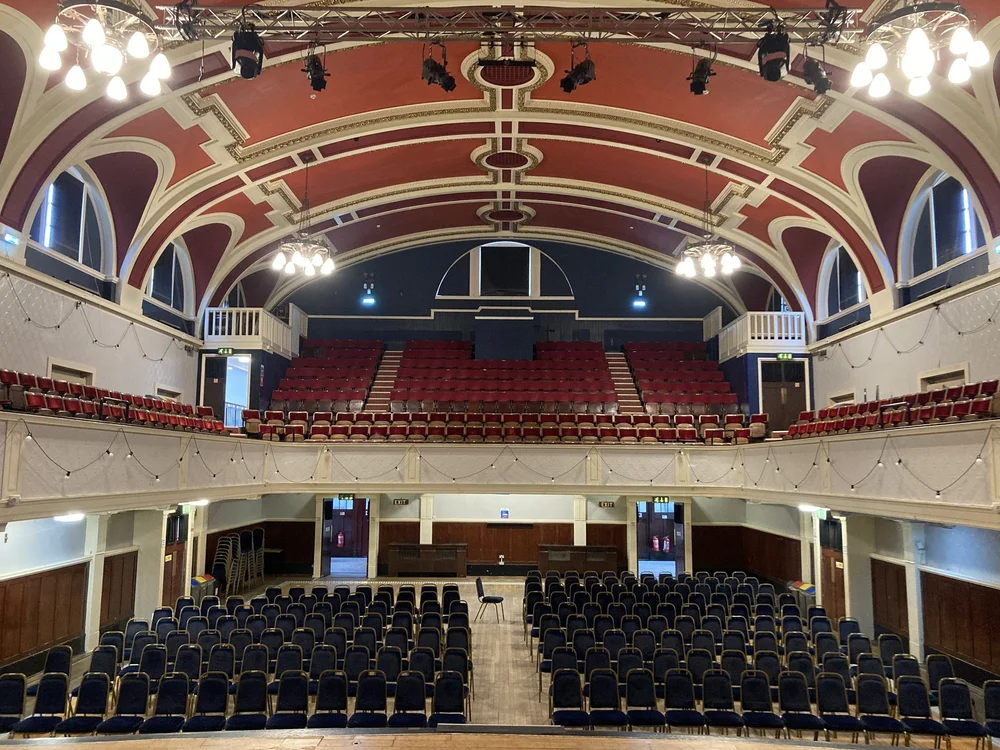 The Main Hall at Portobello Town Hall, looking towards the balcony, with seating laid out across the floor.